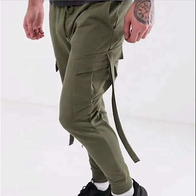 
Fashion DESIGN skinny joggers with cargo pockets and strapping in khaki Manufacturer by Needle Track 