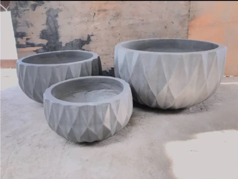 Set of 3 beautifully designed high quality concrete plant pots used to decorate your living space