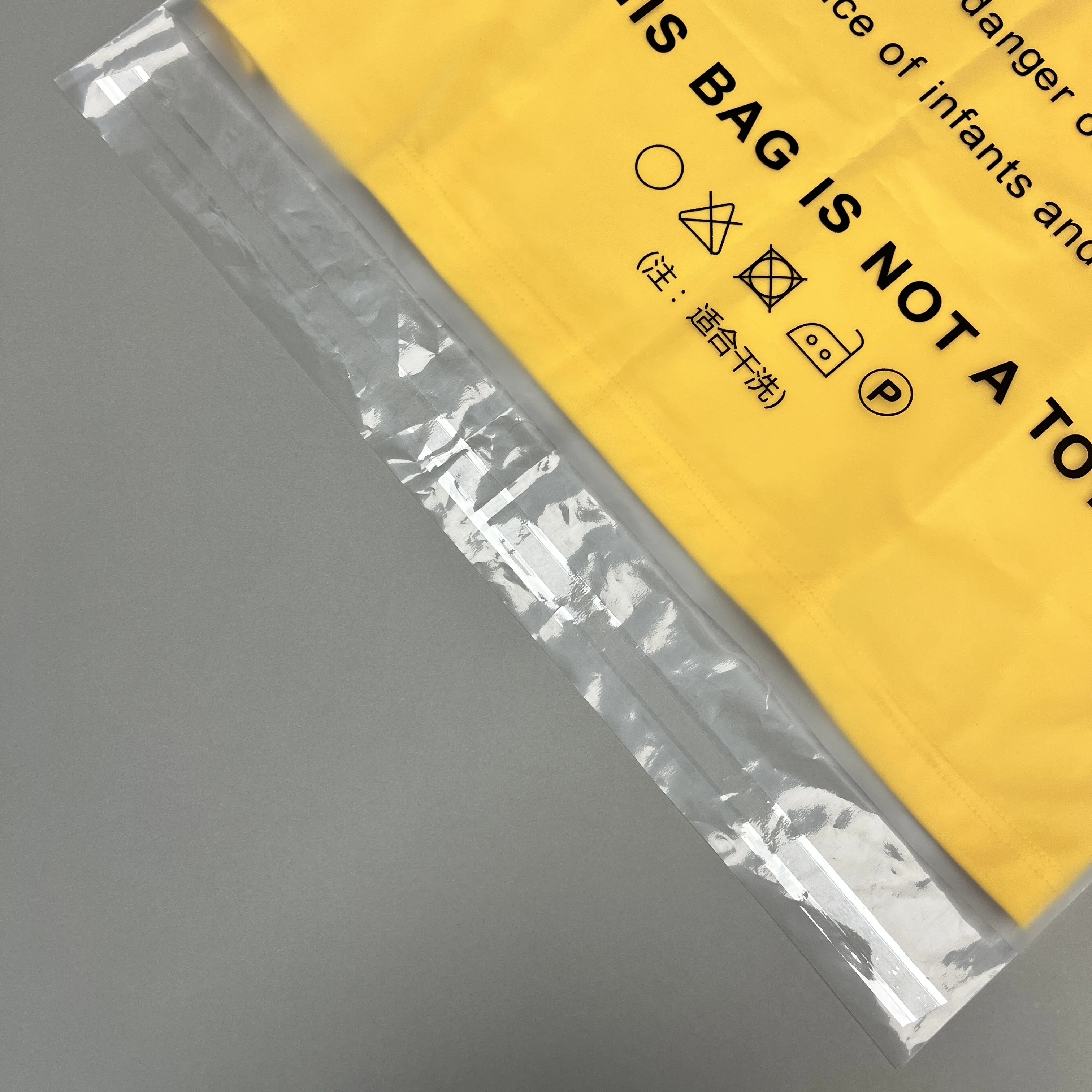 100% Recycled LDPE two tone laundry dry cleaning garment poly bag custom dust bag with warning and self adhesive tape