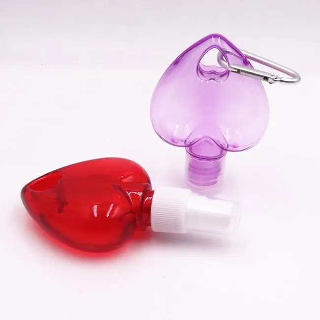 wholesale 50ml empty heart shape plastic PETG HDPE hanging hand sanitizer spray bottle with hook keychain bottles