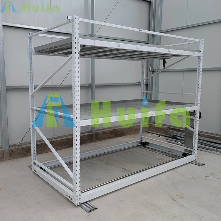 Подвижные вертикальные стеллажи для выращивания растений в теплицах