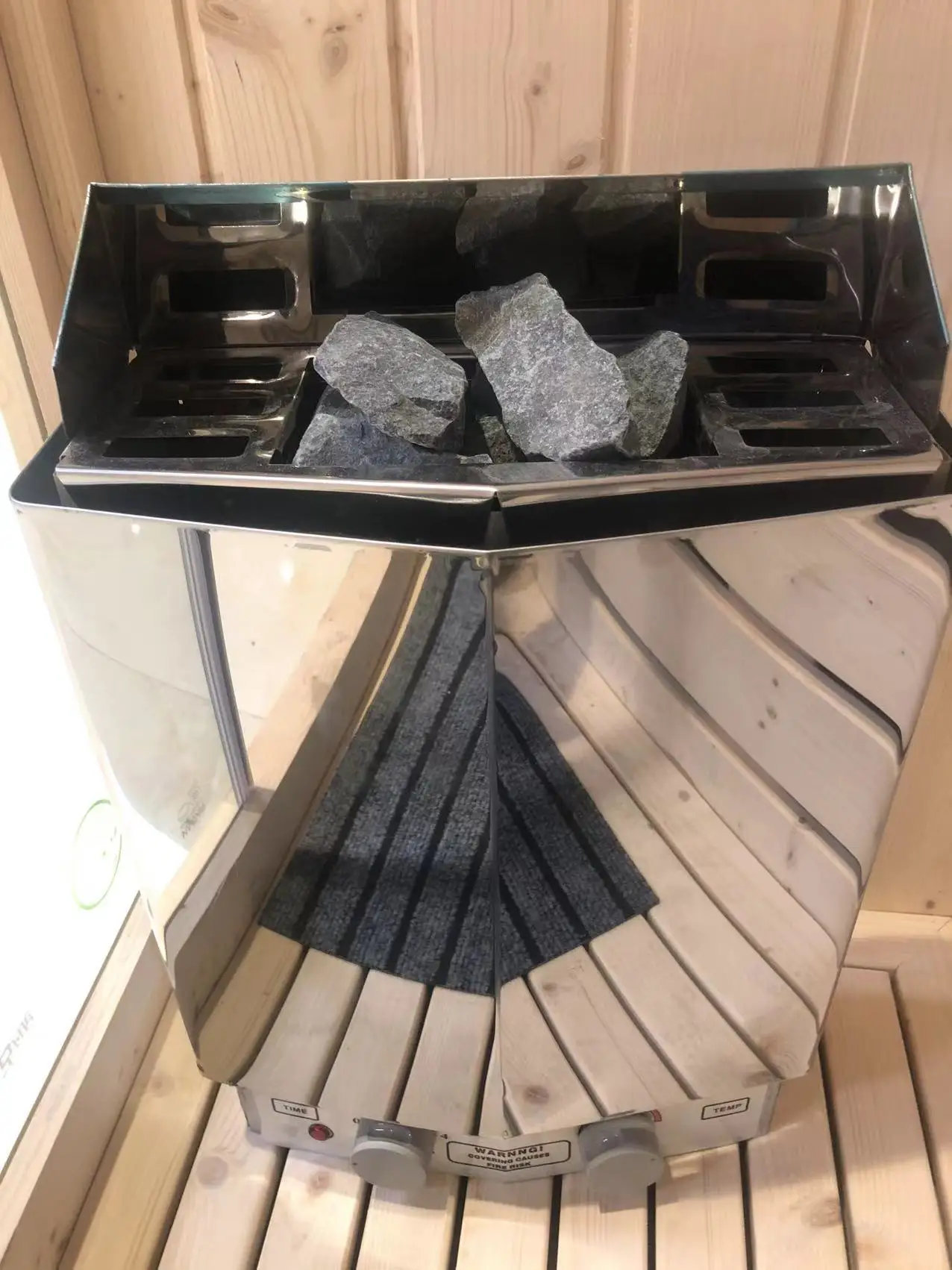 white spruce stone stove sauna room