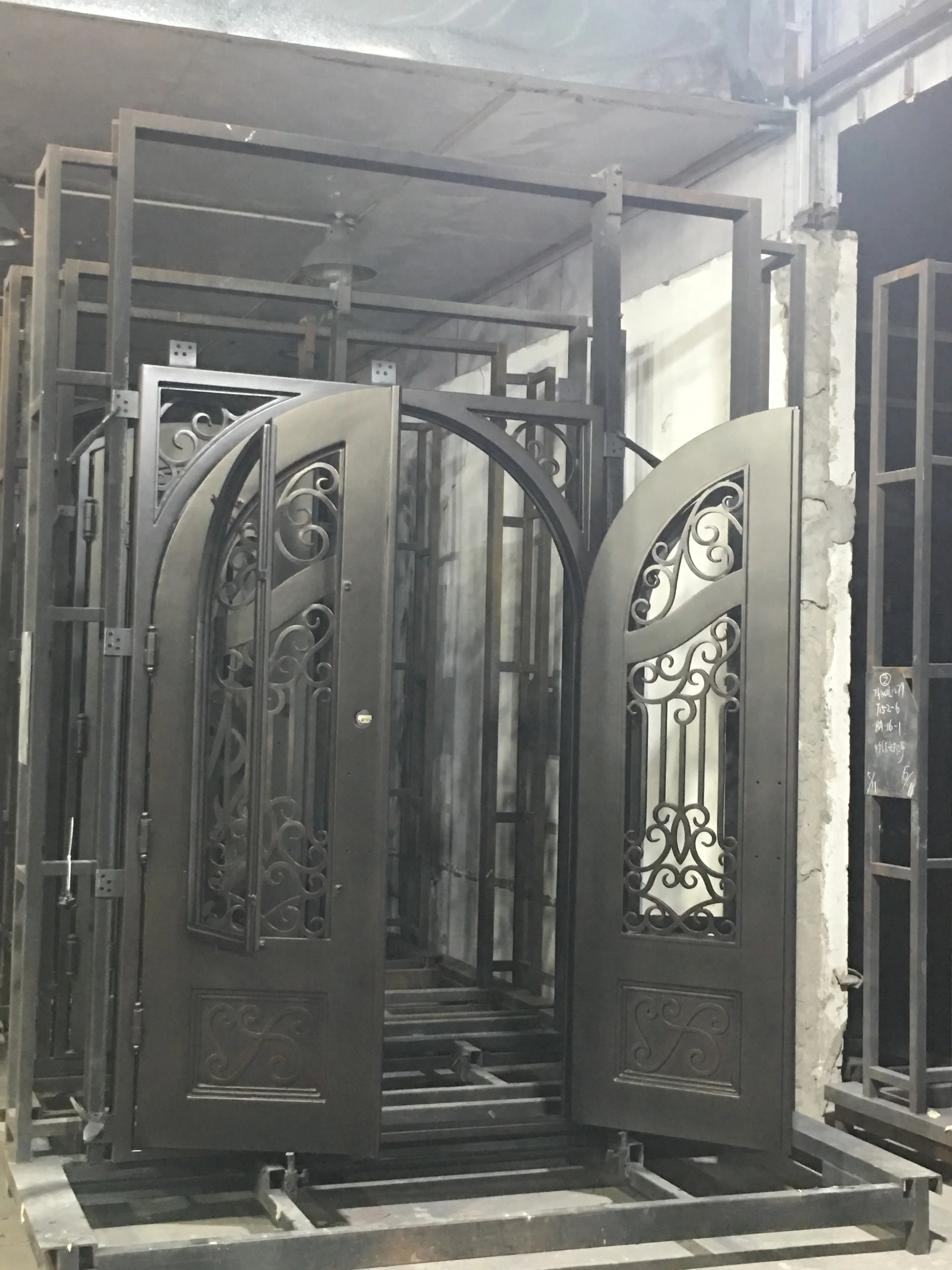 arched double wrought single iron entry doors