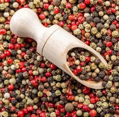 Round shaped red, black and white pepper