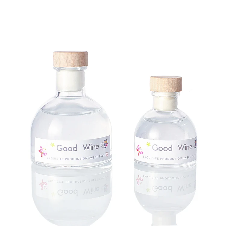 Wholesale from factory 50ML 100ML round transparent mini whiskey wine 150ml glass vodka whiskey bottle with cork cap