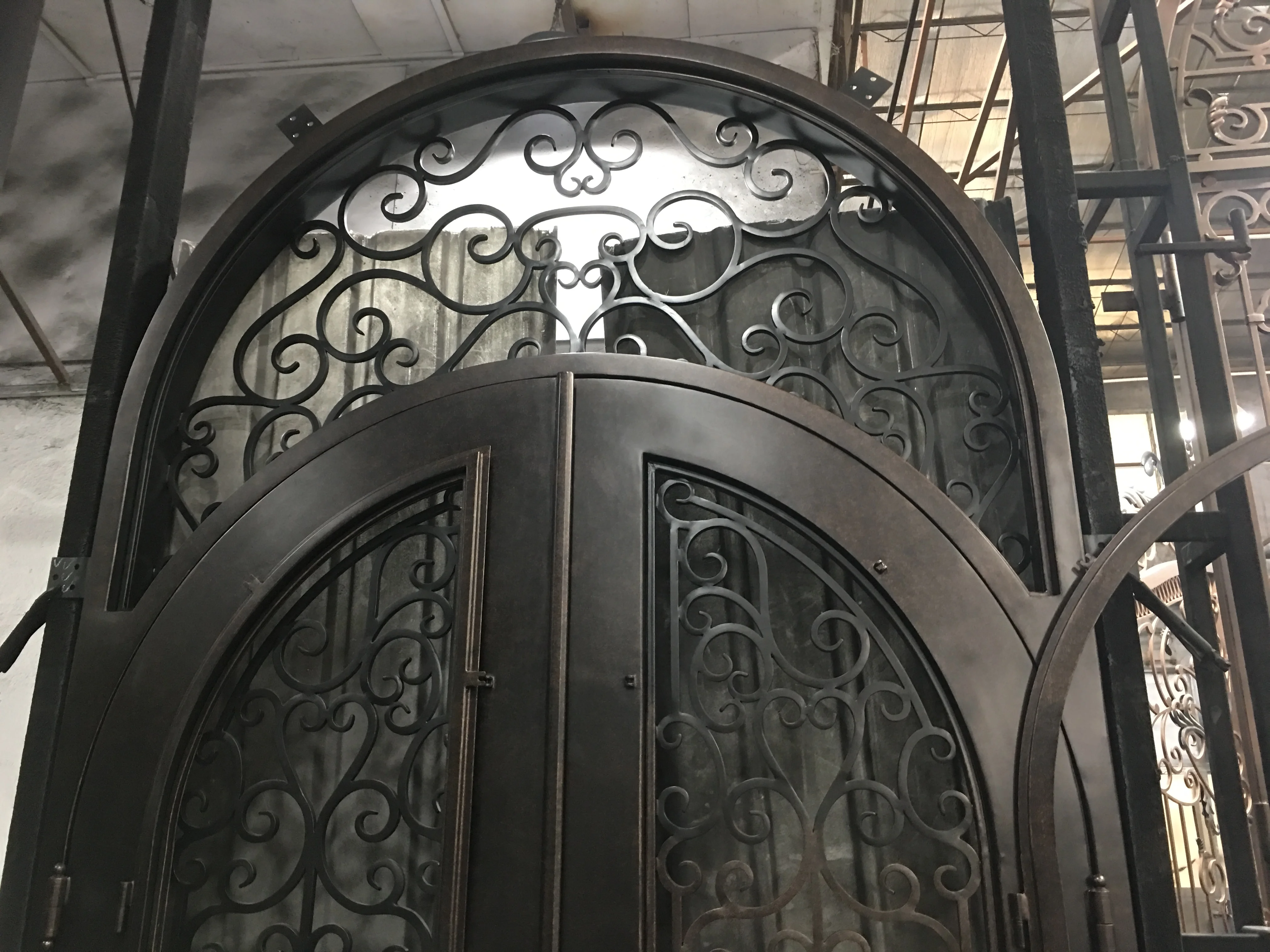 arched double wrought single iron entry doors