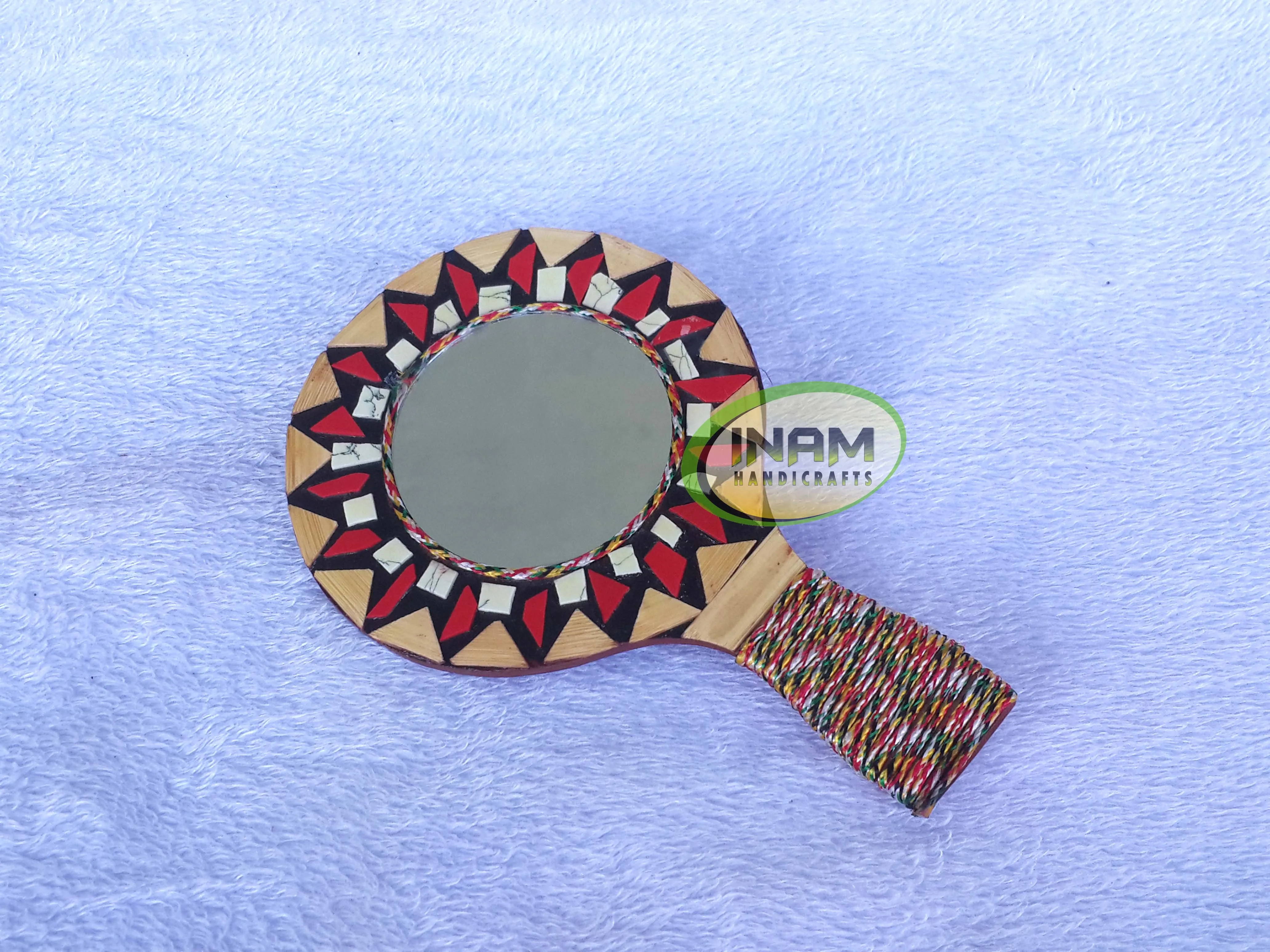 Modern hand held mirror for shaving , makeup etc.