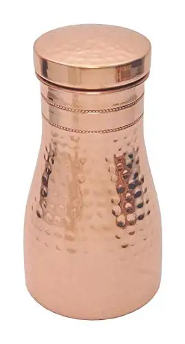 Copper bottle in copper color finished in hammered .
