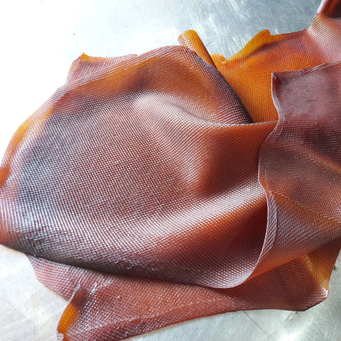 Ribbed Smoked Sheet - Raw Rubber Material packaged every 20kg per bale wrapped in thin polyethylene plastic bag