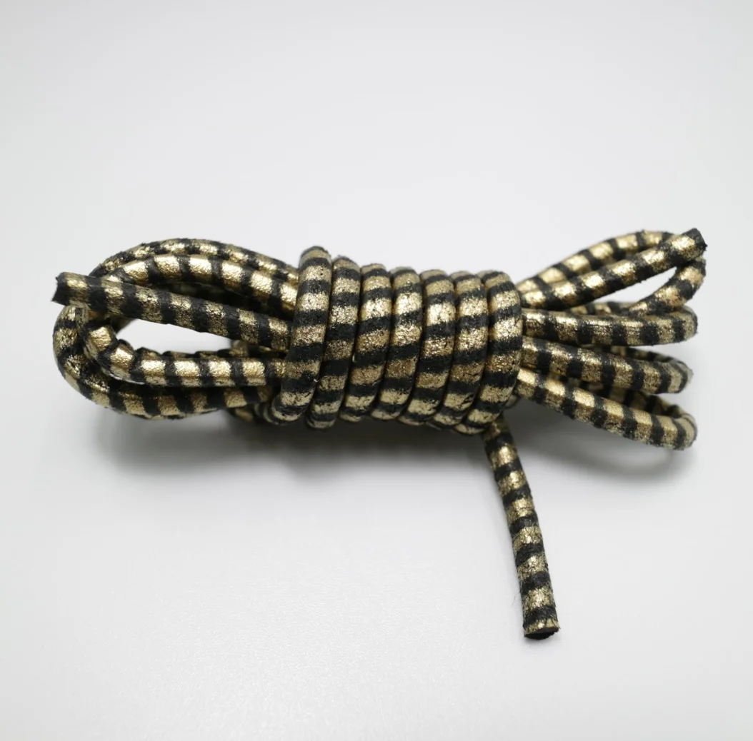  100% Rawhides производит кожаные шнурки для обуви с металлическим принтом