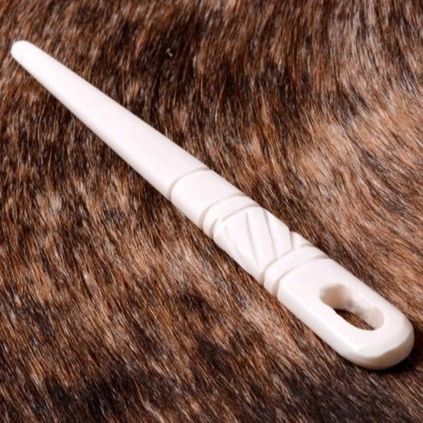 natural and historical bone needles with engraving design from viking age for using in knitting