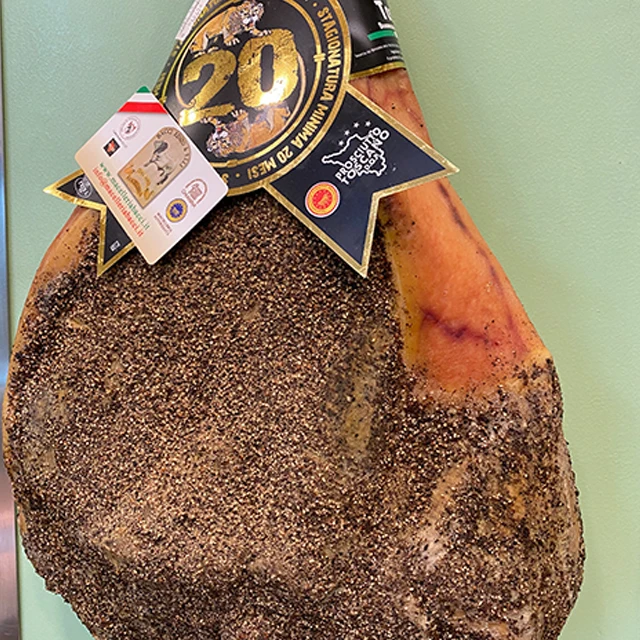 Italian food MACELLERIA BACCI cured pork meat pork leg tuscan prosciutto DOP raw and seasoned