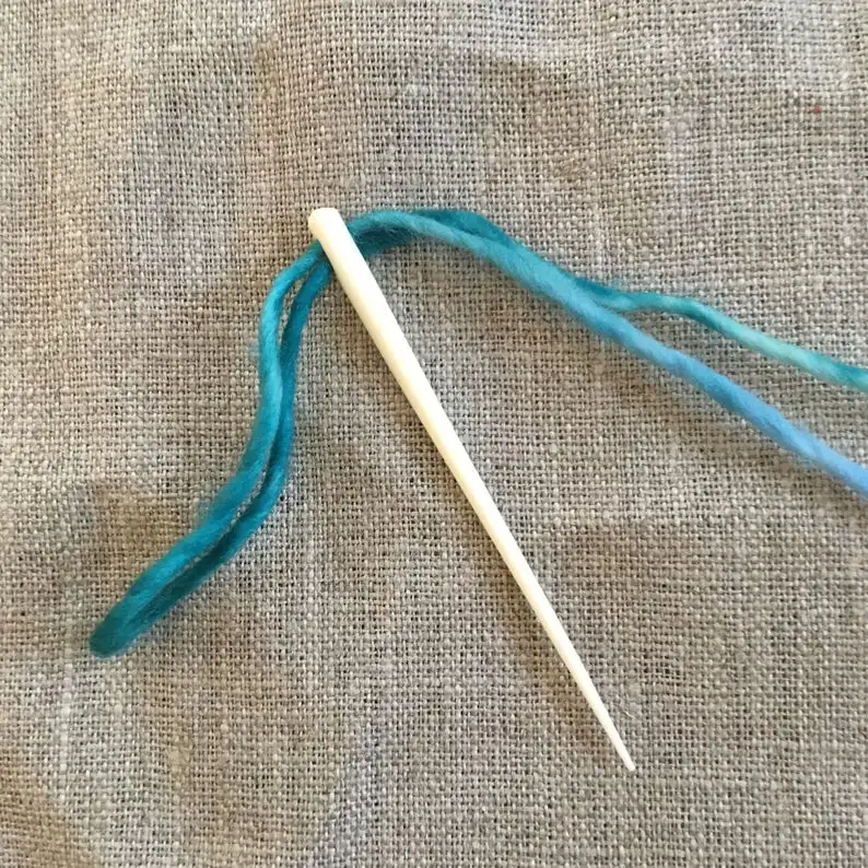 natural and historical bone needles with engraving design from viking age for using in knitting