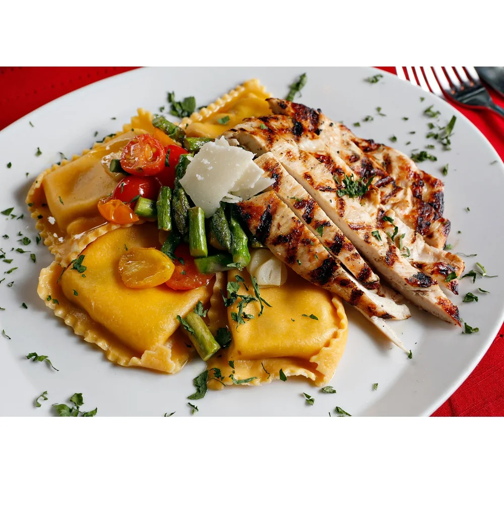 Blue Crab Ravioli  Egg Dough Blended w/roasted peppers Onions & Cilantro Large Square