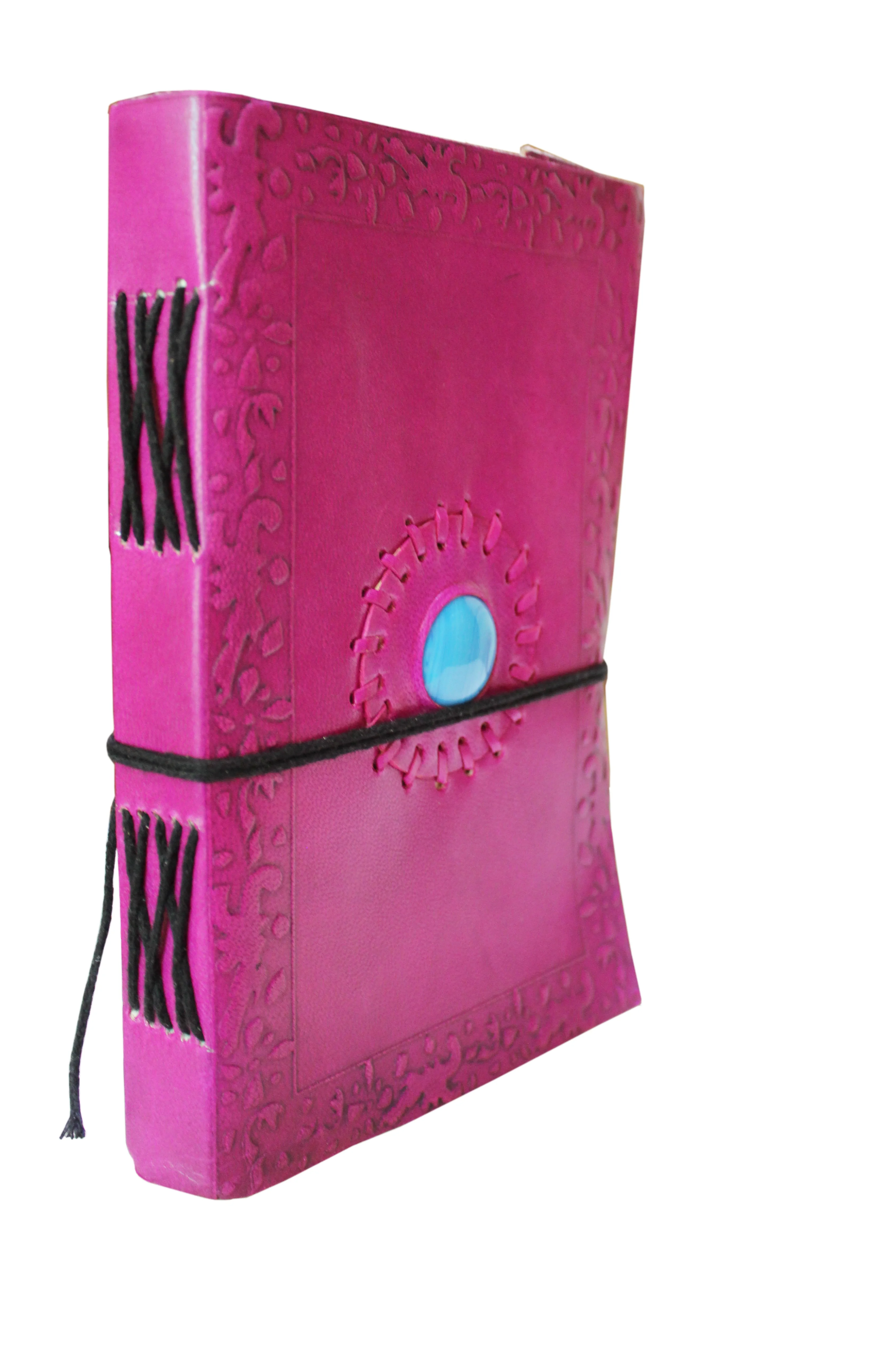 Leather journal pink color embossed design center sky color stone with black cotton thread closer diary