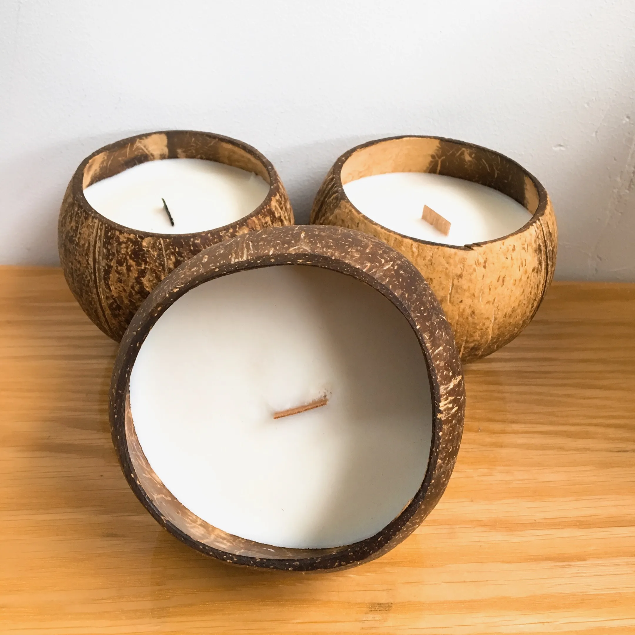Natural eco friendly handmade candles in coconut shell bowls
