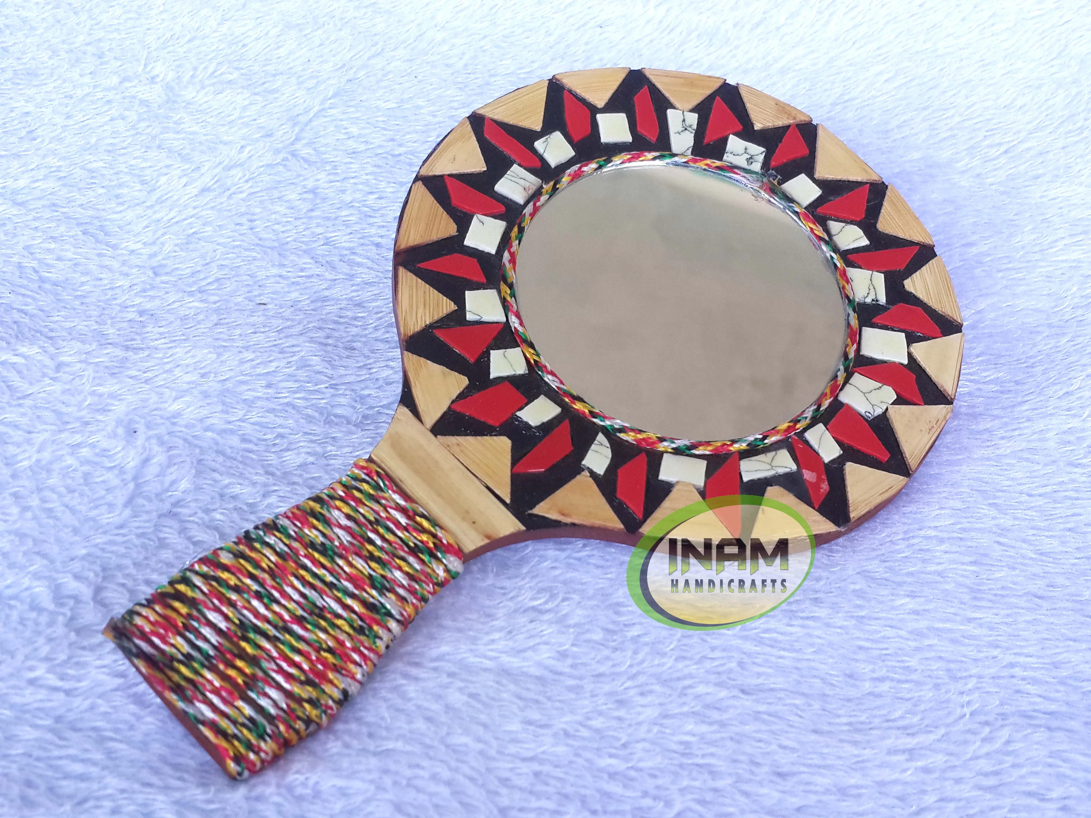 Modern hand held mirror for shaving , makeup etc.