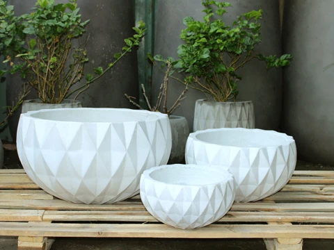Set of 3 beautifully designed high quality concrete plant pots used to decorate your living space