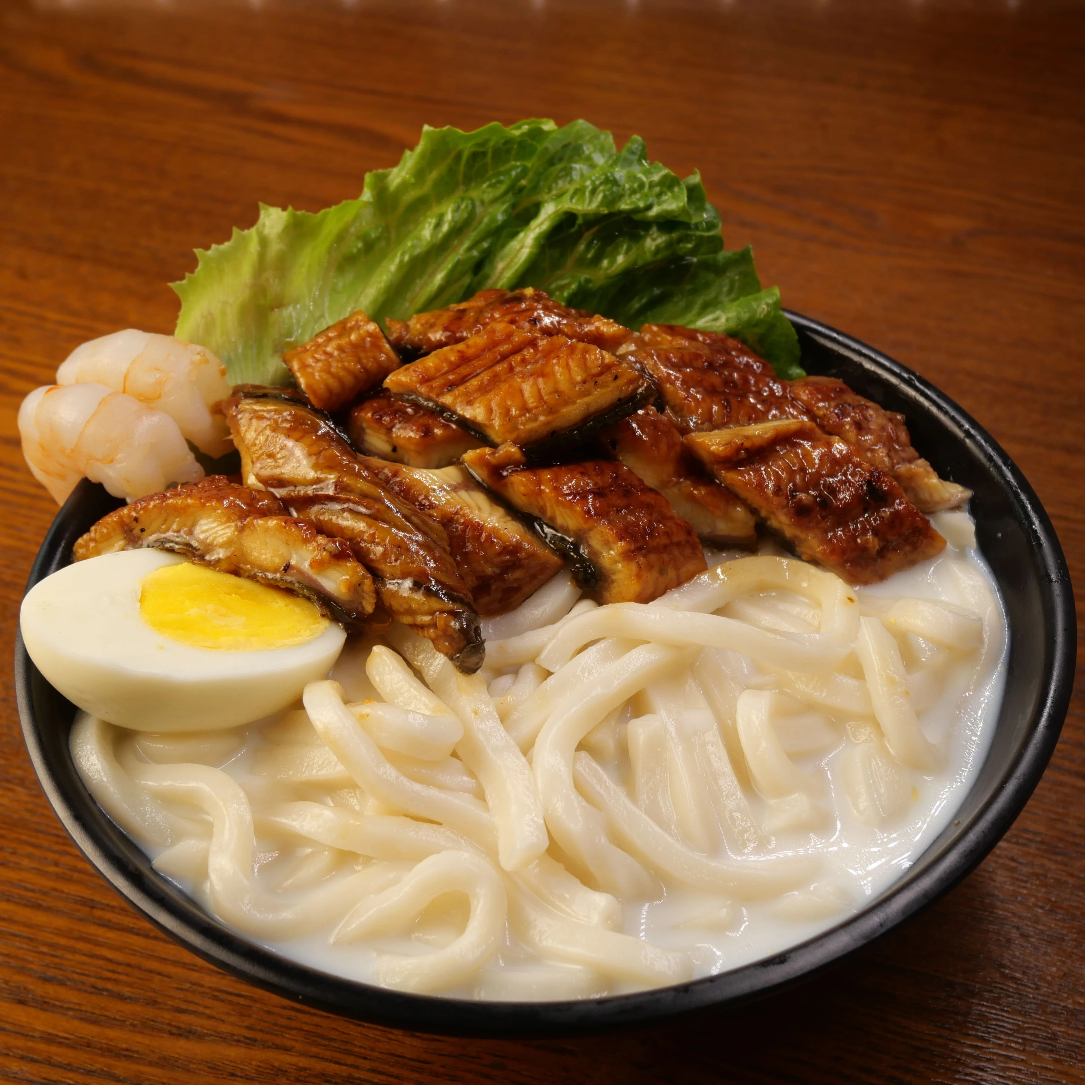 Hidee Udon with a variety of fresh vegetables and seafood parwn eel noodles