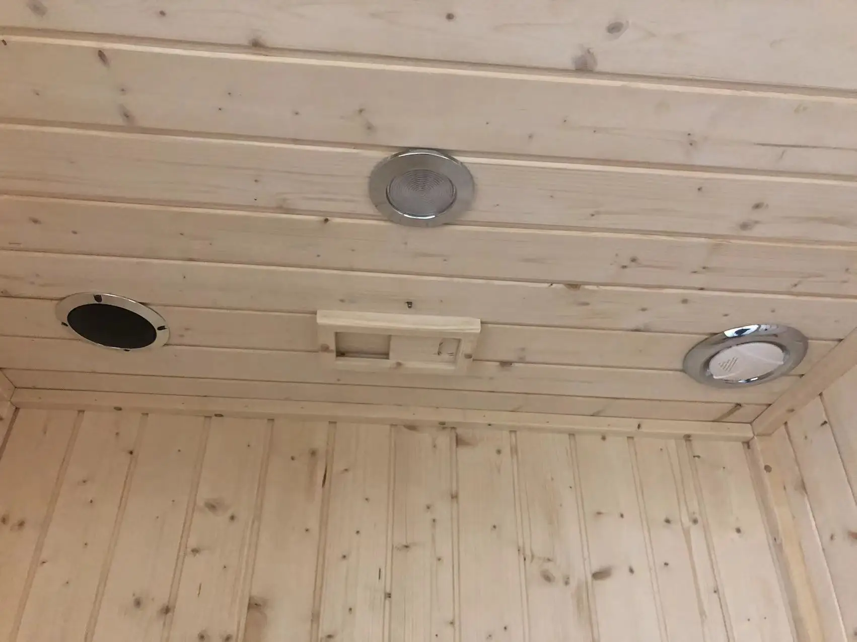 white spruce stone stove sauna room