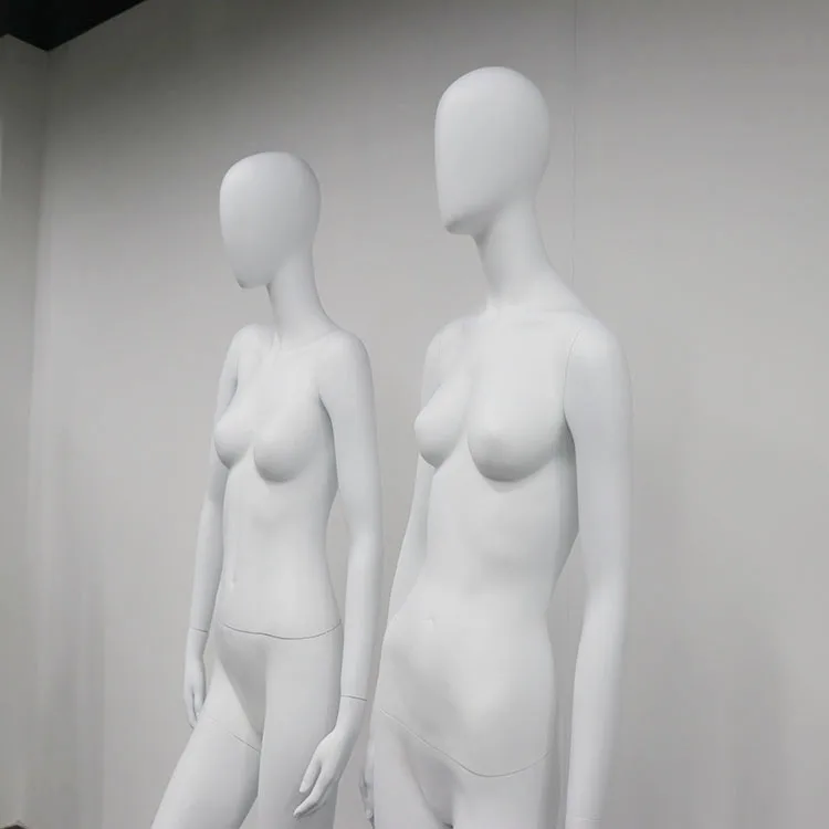 Abstract female full body white matte FRP manikin with egg head