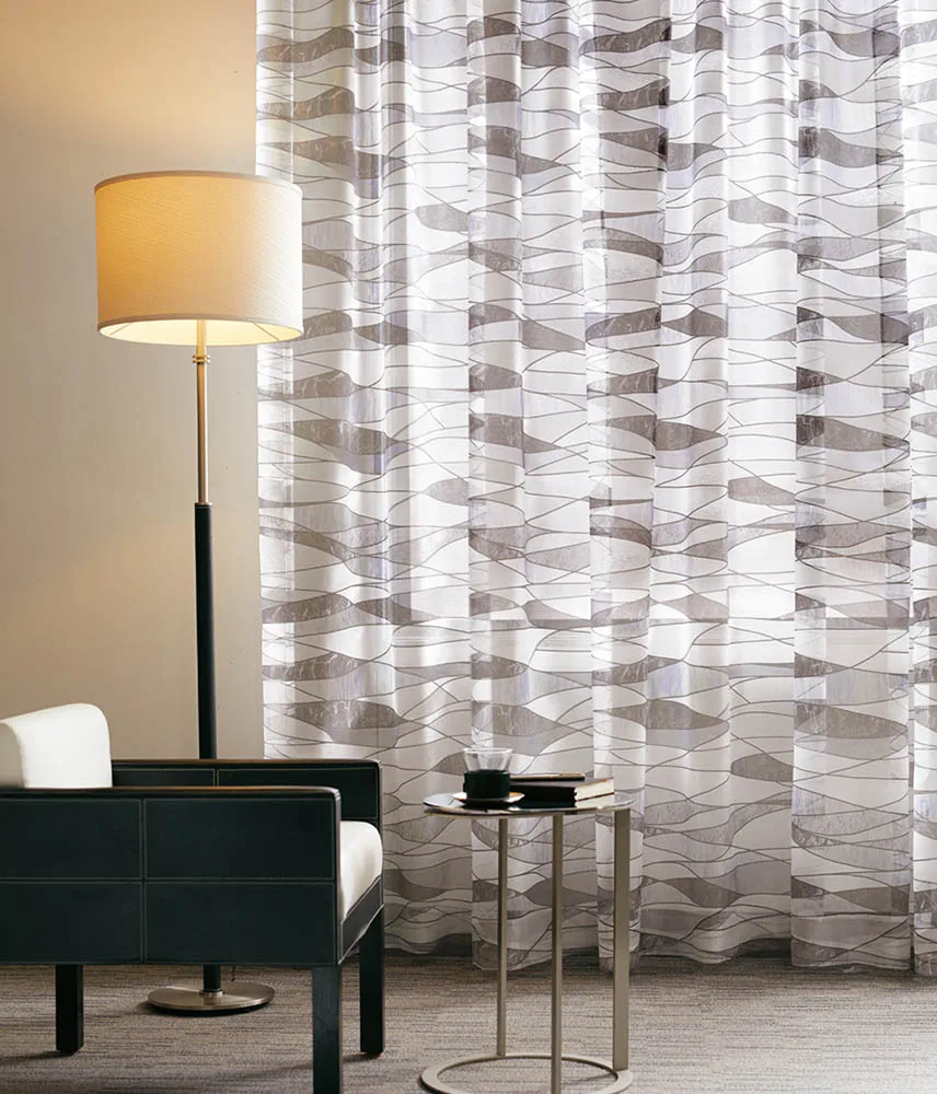 Fashionable and durable curtain fabric with yellow stained glass texture and transparency.