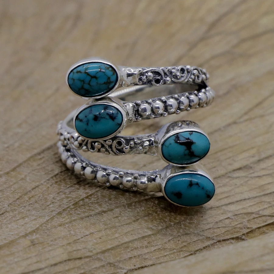
Carved Overlapping Silver Ring with Turquoise 