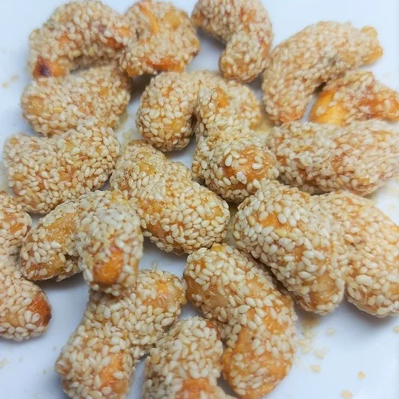 Premium White Sesame Coating Crispy Sweet Roasted Dried Cashew Nuts By Hola with COMMON Cultivation Type