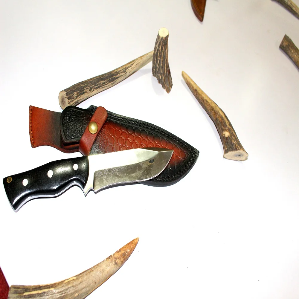 
1095 HIGH CARBON STEEL HUNTING KNIFE WITH BLACK MICARTA HANDLE STEEL PINS IN IT 
