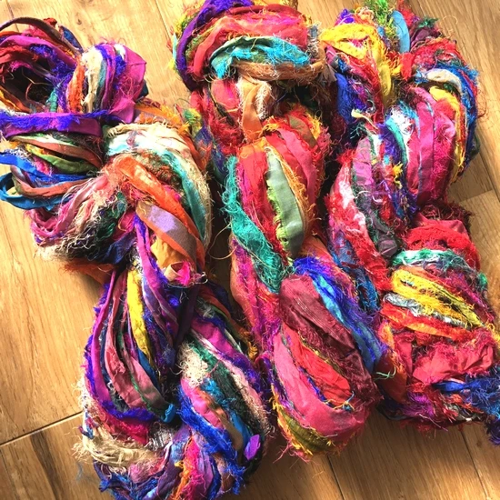 sari silk ribbon made from recycled silk sari available in 100 gram skeins suitable for yarn and fibre stores and for jewellery