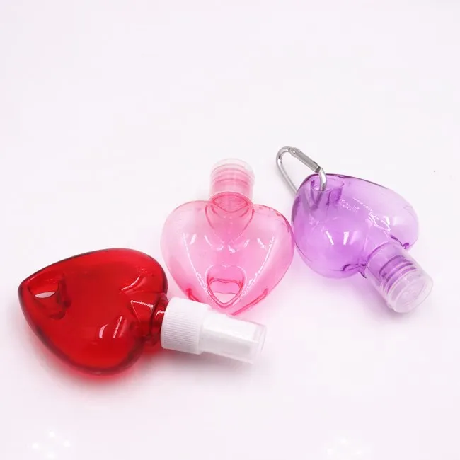 wholesale 50ml empty heart shape plastic PETG HDPE hanging hand sanitizer spray bottle with hook keychain bottles