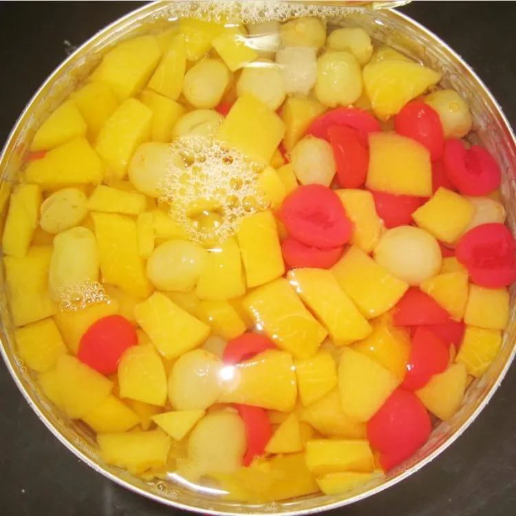 Delicious canned mixed fruit in syrup cocktail
