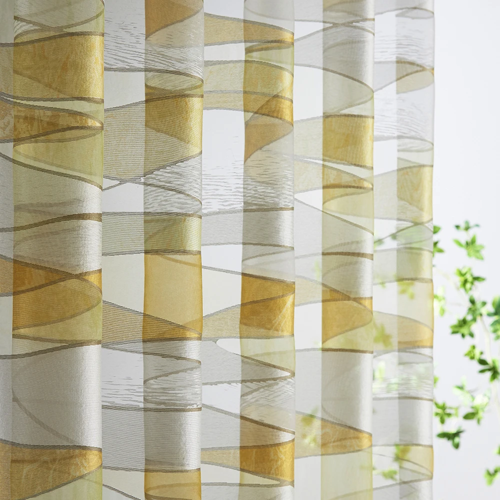 Fashionable and durable curtain fabric with yellow stained glass texture and transparency.