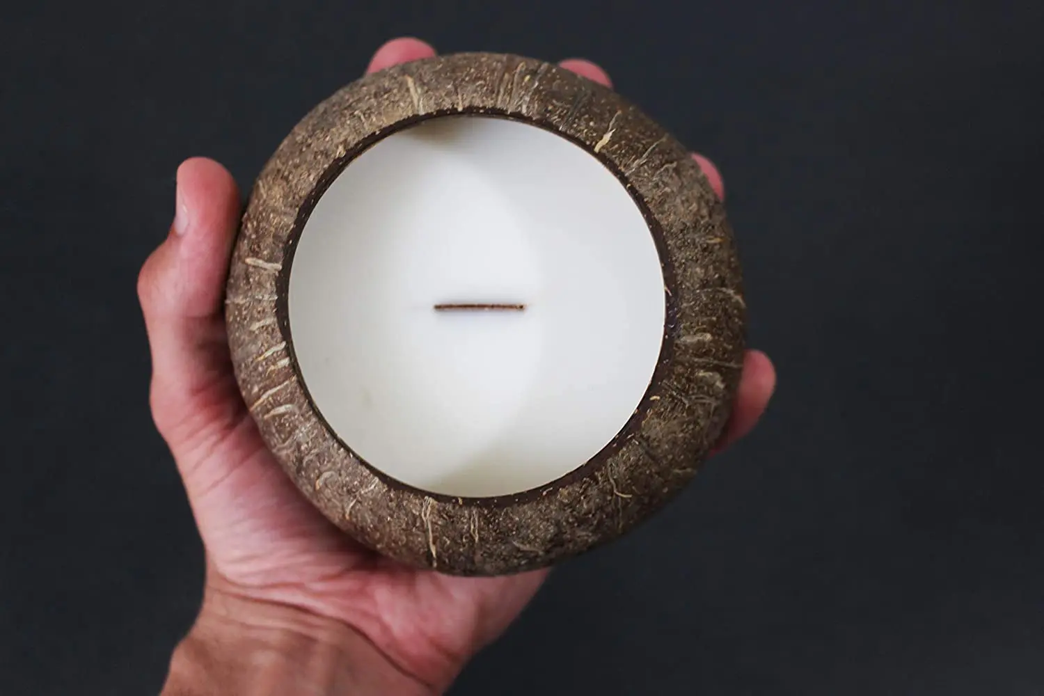 Natural eco friendly handmade candles in coconut shell bowls