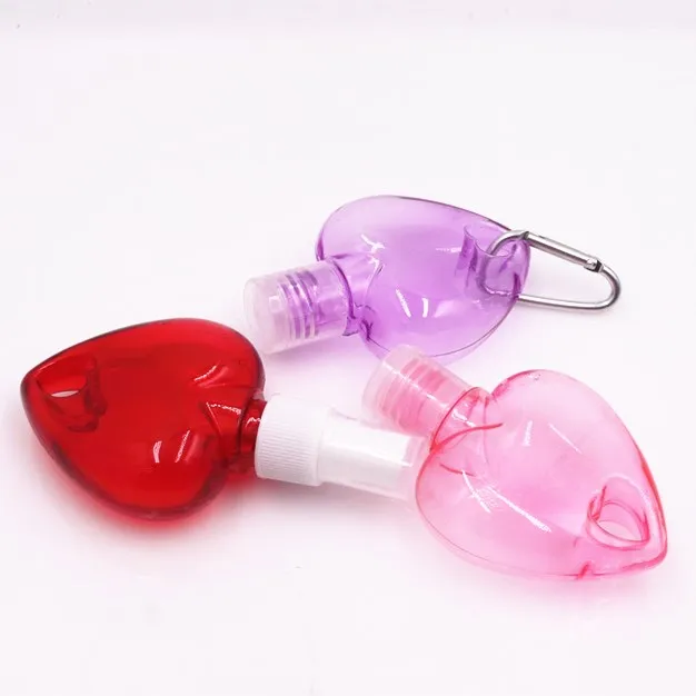 wholesale 50ml empty heart shape plastic PETG HDPE hanging hand sanitizer spray bottle with hook keychain bottles