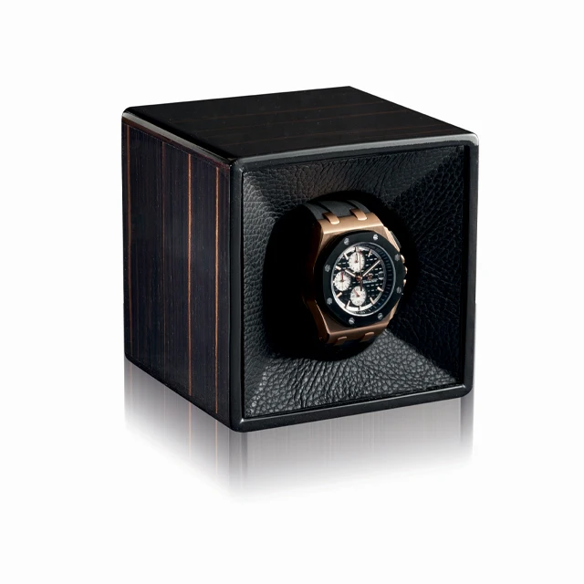 Watch winder in polished ebony for automatic watch. Leather lined . Winder made in Switzerland. Watch winder