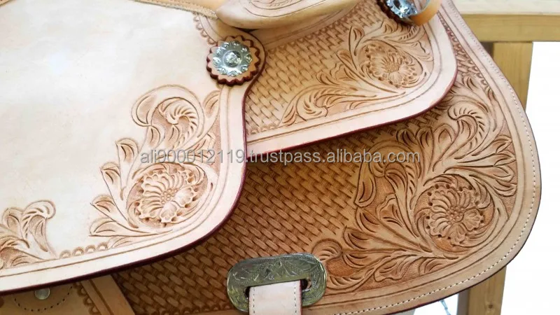 Western treeless saddle Hand tooled and carved