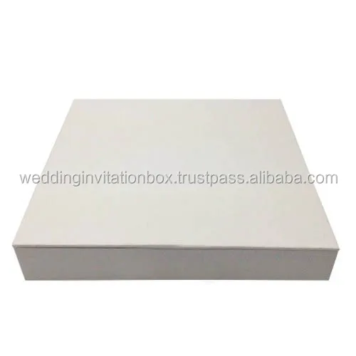 White hand-crafted paper wedding invitation box with thick cardboard walls