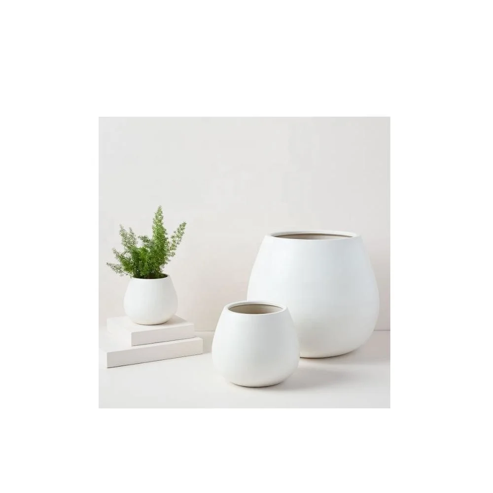 Set Pure White Ceramic Planters It will look great around your home as well as making beautiful centre piece