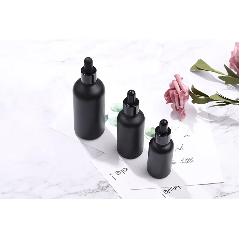 High end custom frosted matte black cosmetic glass bottle for lotion serum essential oil