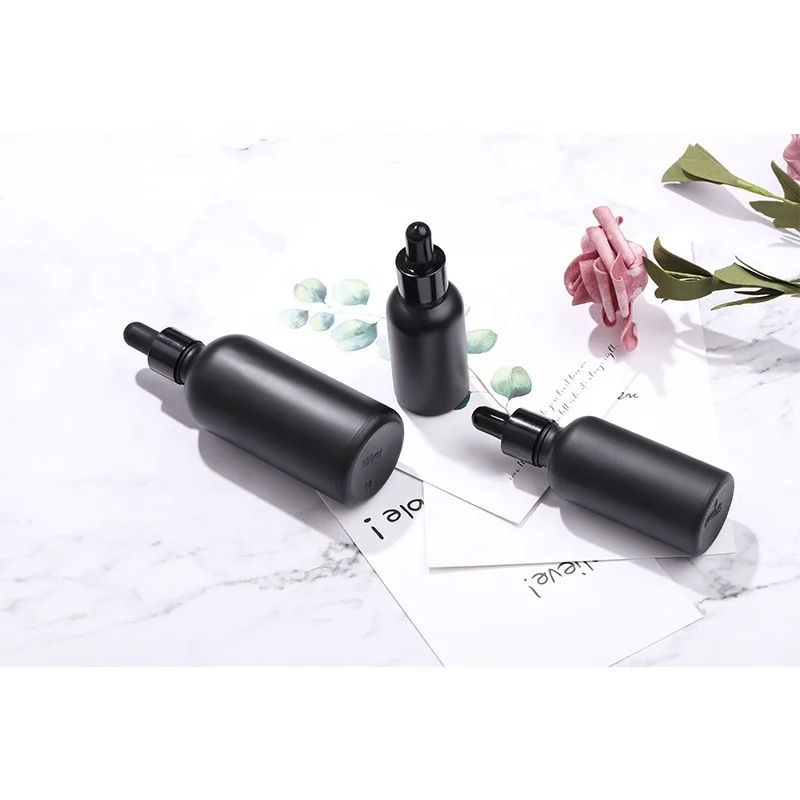 High end custom frosted matte black cosmetic glass bottle for lotion serum essential oil