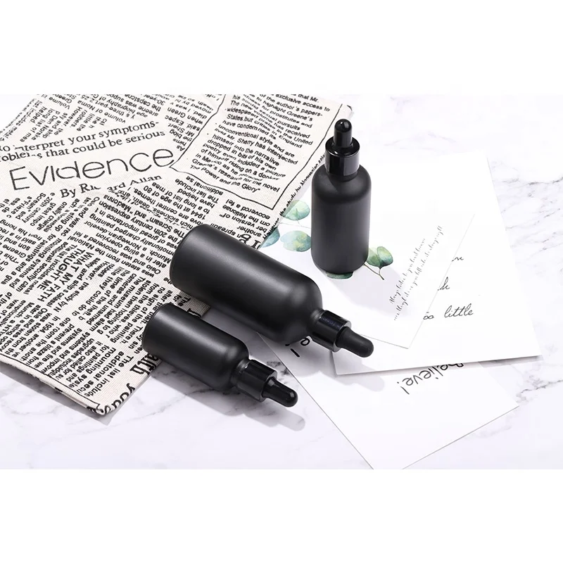 High end custom frosted matte black cosmetic glass bottle for lotion serum essential oil