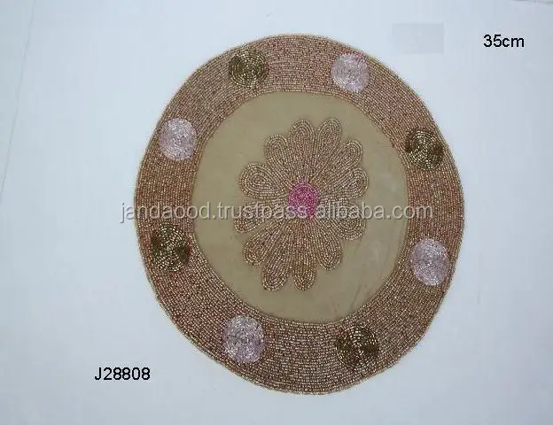 
Glass bead place mats with floral patterns on brown base glass beads other patterns available 