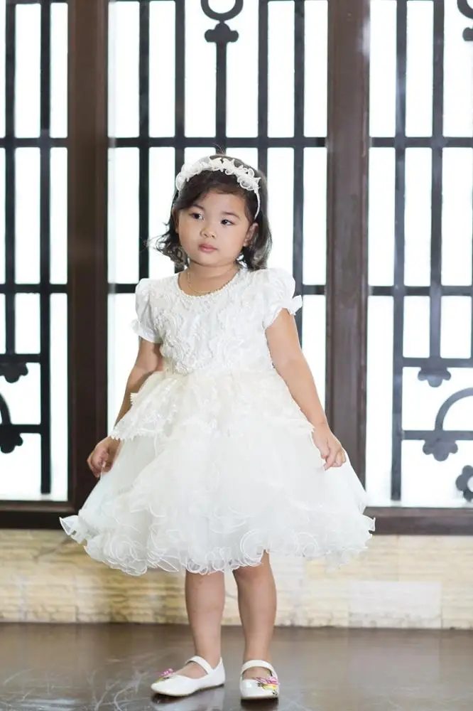 Beautiful white collection kid clothes dresses princess dress for girls, puffy layered dress for birthday party wearing.
