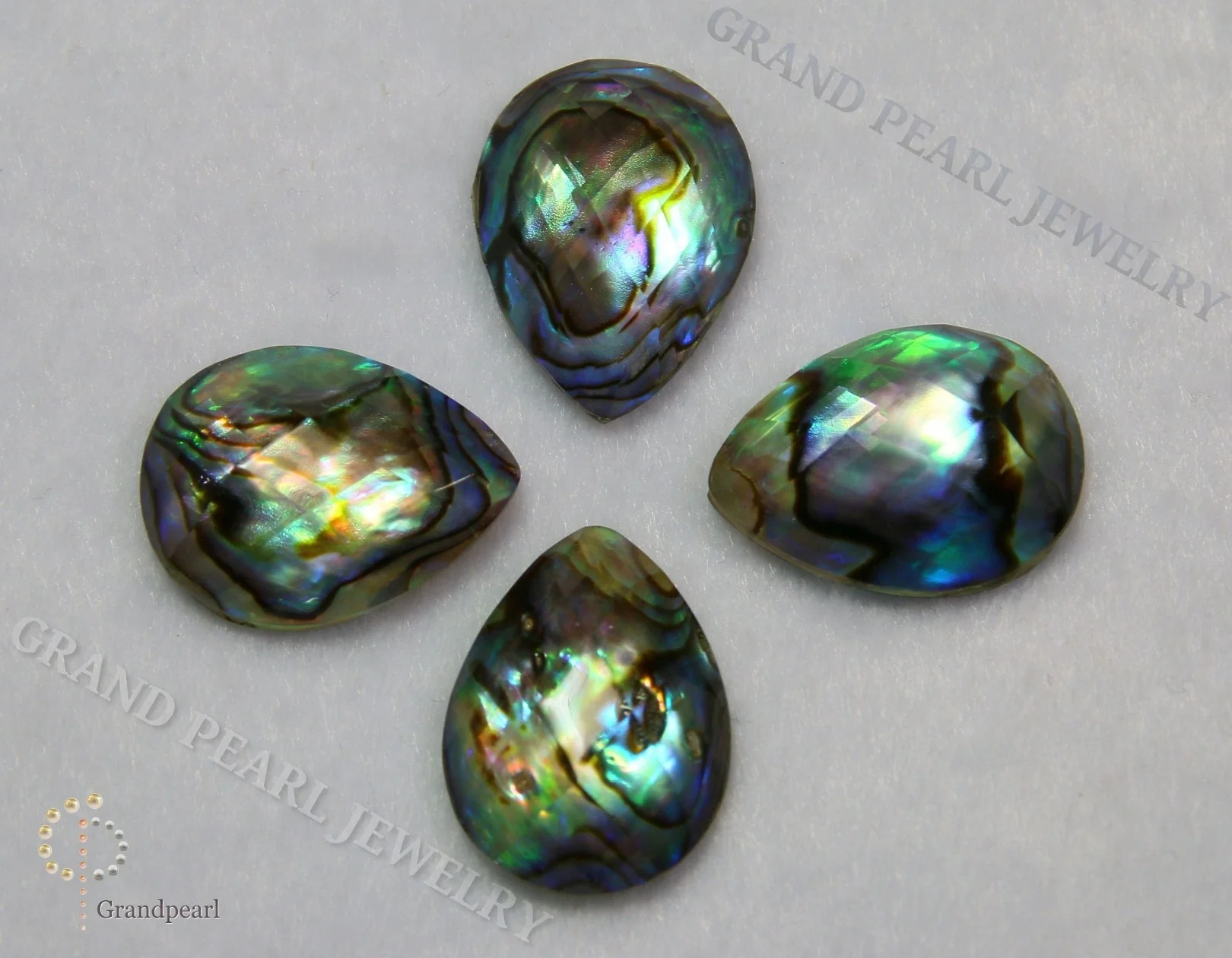 
MOP Doublet Cabochon - 15x20mm Paua Shell combined with faceted crystal - Pear 