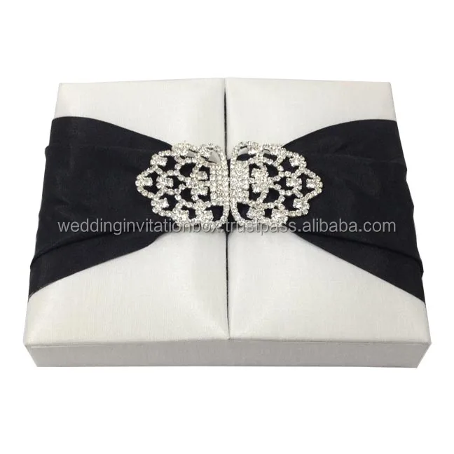 White hand-crafted paper wedding invitation box with thick cardboard walls