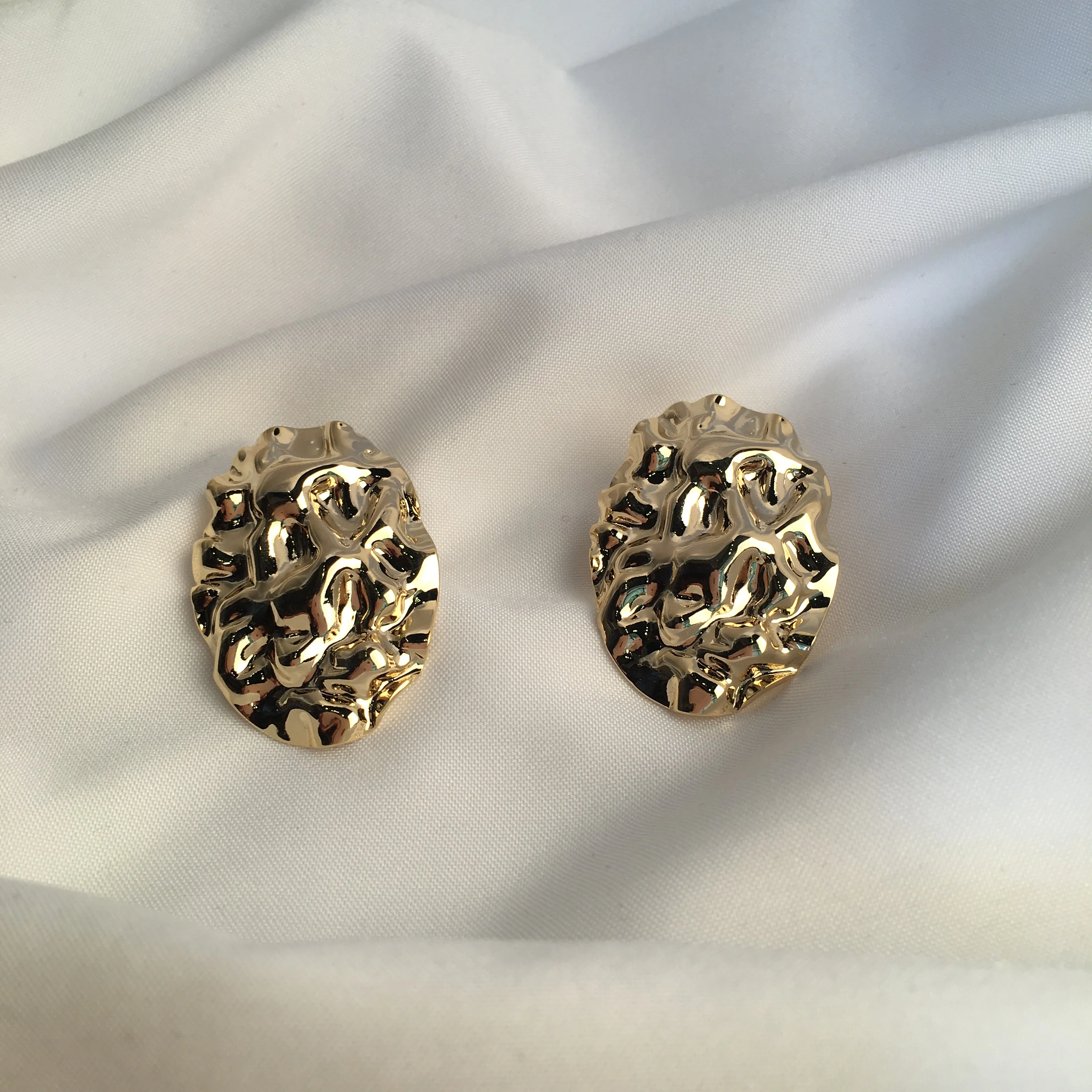 BLAIR K. Its brass. Fashion earrings decorated with gold color.