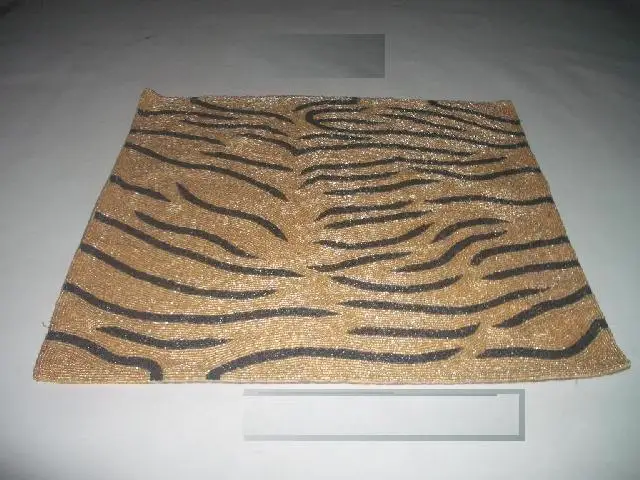 
Glass bead place mats with gold and black patterns other patterns available 