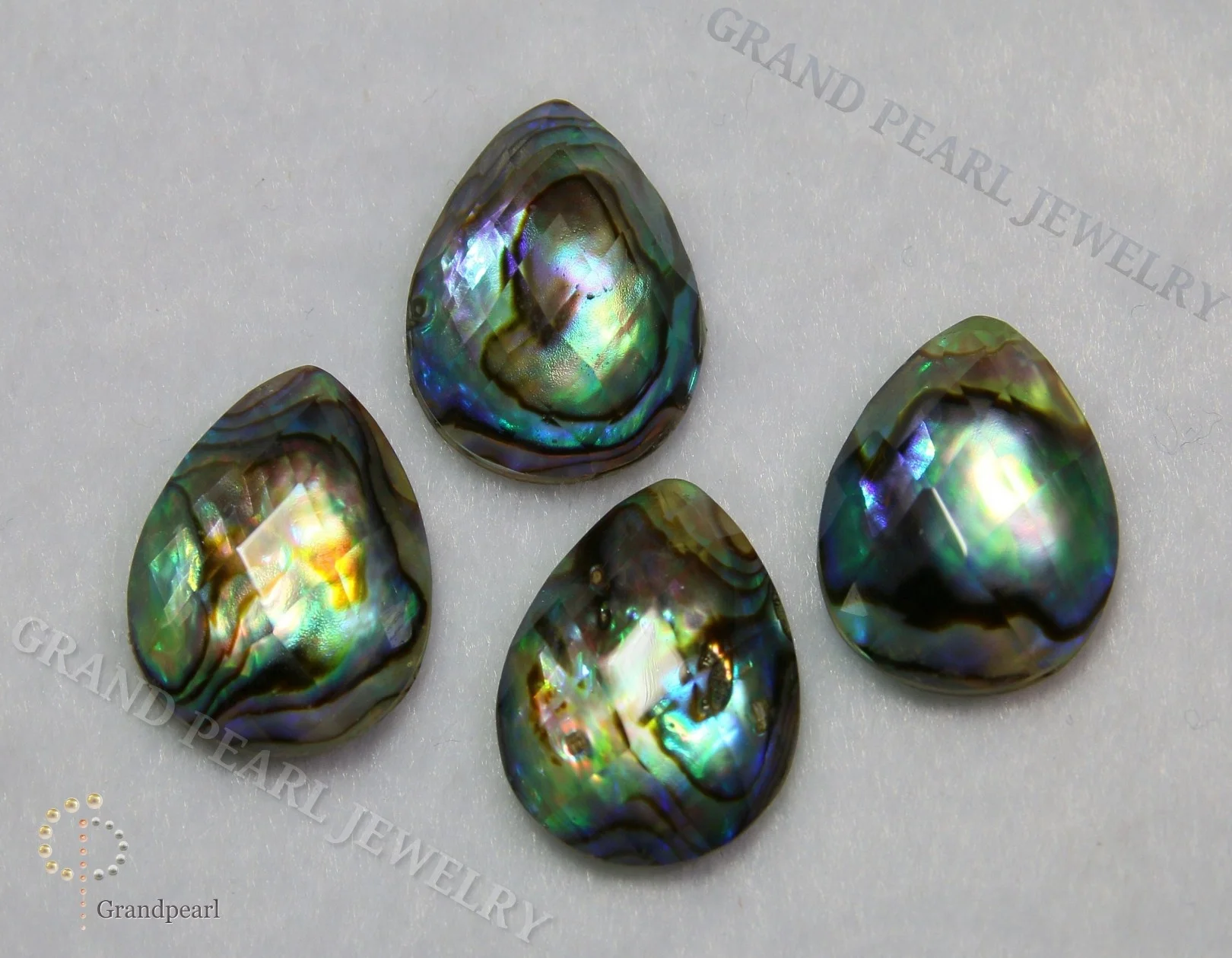 
MOP Doublet Cabochon - 15x20mm Paua Shell combined with faceted crystal - Pear 