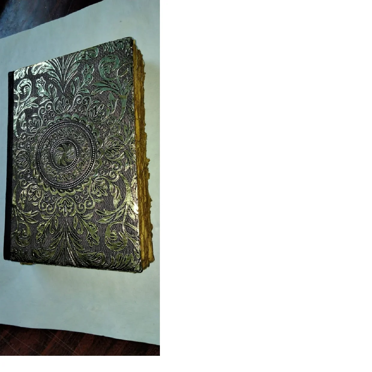 custom made leather embossed journals with deep foil stamping and embossing with vintage look deckle edged papers